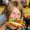 A younger patron gets ready to dig into a big burger from Rony's Rockin' Grill.