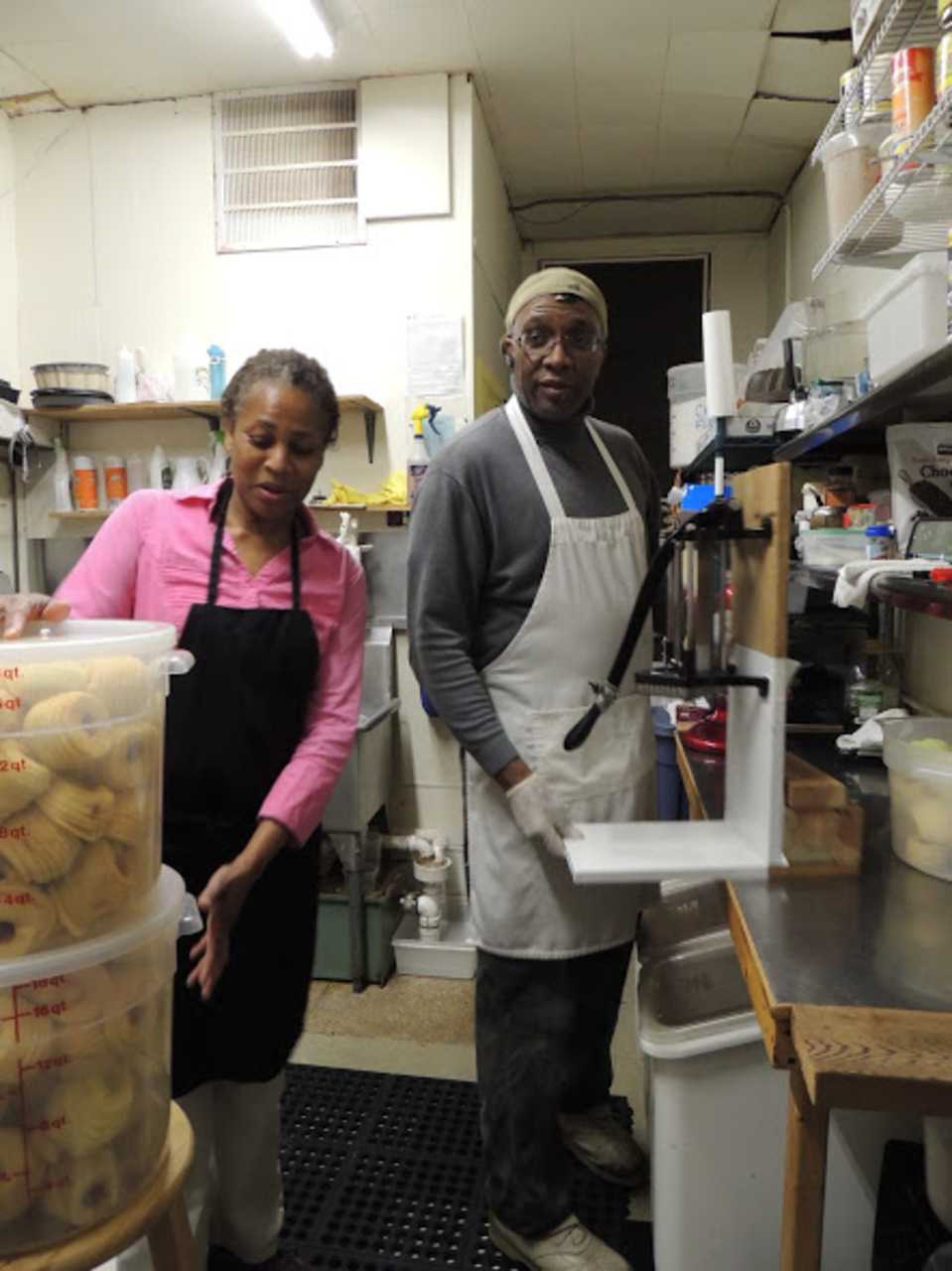 There's a familiar ease with Angela and Melvin Logan in the bakery's kitchen. Melvin is standing beside a commercial french fry cutter he retrofitted to dice apples. Angela says he's very handy with mechanical objects.