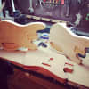Locally sourced materials are used in the making of a Grosbeak guitar.