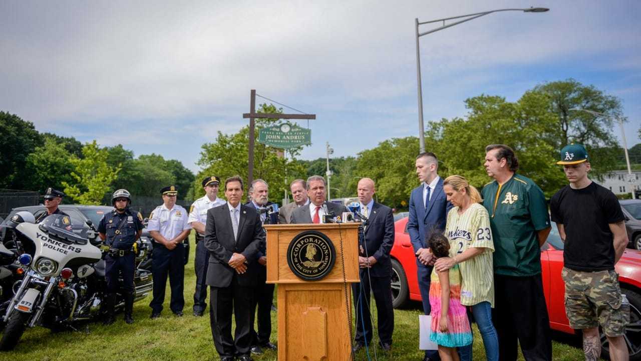 Yonkers officials with the family of Michael Nolan announcing the Michael Nolan Law last year.