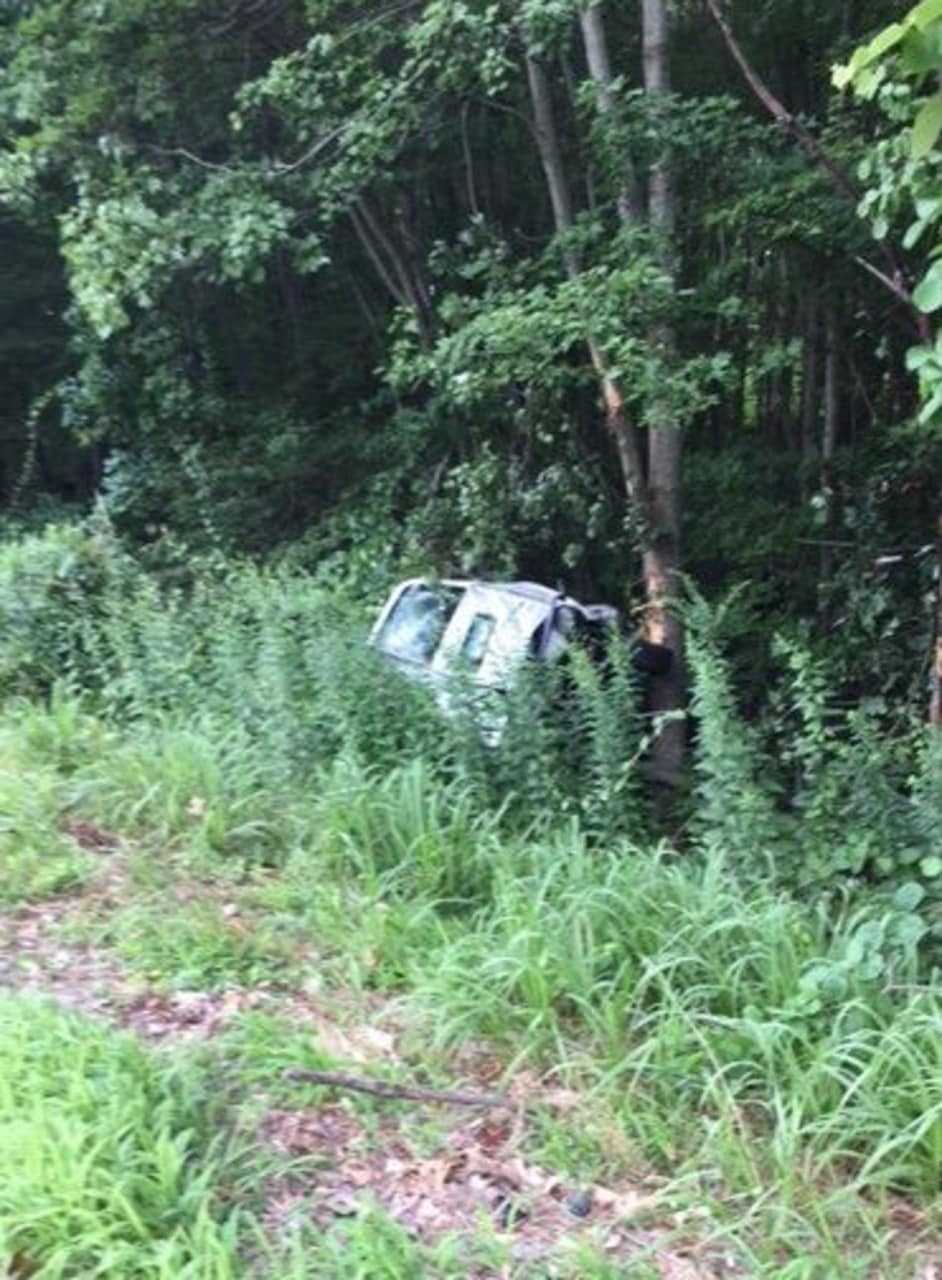 One vehicle crossed over the median of Route 8, slammed into another and ended up in the woods off the highway in a serious rollover crash Thursday morning in Shelton.