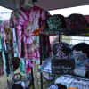 Hand-painted hats and tie-dyed shirts from Delusional Designs.