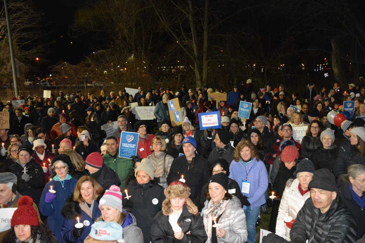 Demonstrators at a Chappaqua interfaith vigil hold candles. The vigil was held to protest President Donald Trump's ban on admitting refugees into the country.