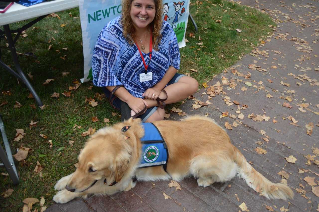 The Newtown-Strong Therapy Dogs are a popular attraction at the sixth annual Passport to Sandy Hook event held by the Sandy Hook Organization for Prosperity.