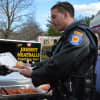 Johnny Meatballs feeds a member of the Paramus Police Motorcycle Unit.