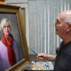 Sal Caldarone with a portrait he painted of his wife, Clara.