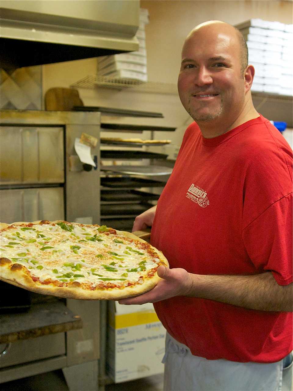 Danny's owner Danny Morton, with one of his hugely popular pizzas.