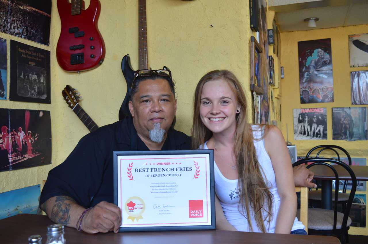 Rony Alvarado, left, owner, and Lauren Kelly, waitress, at Rony's Rockin' Grill in Bergenfield.