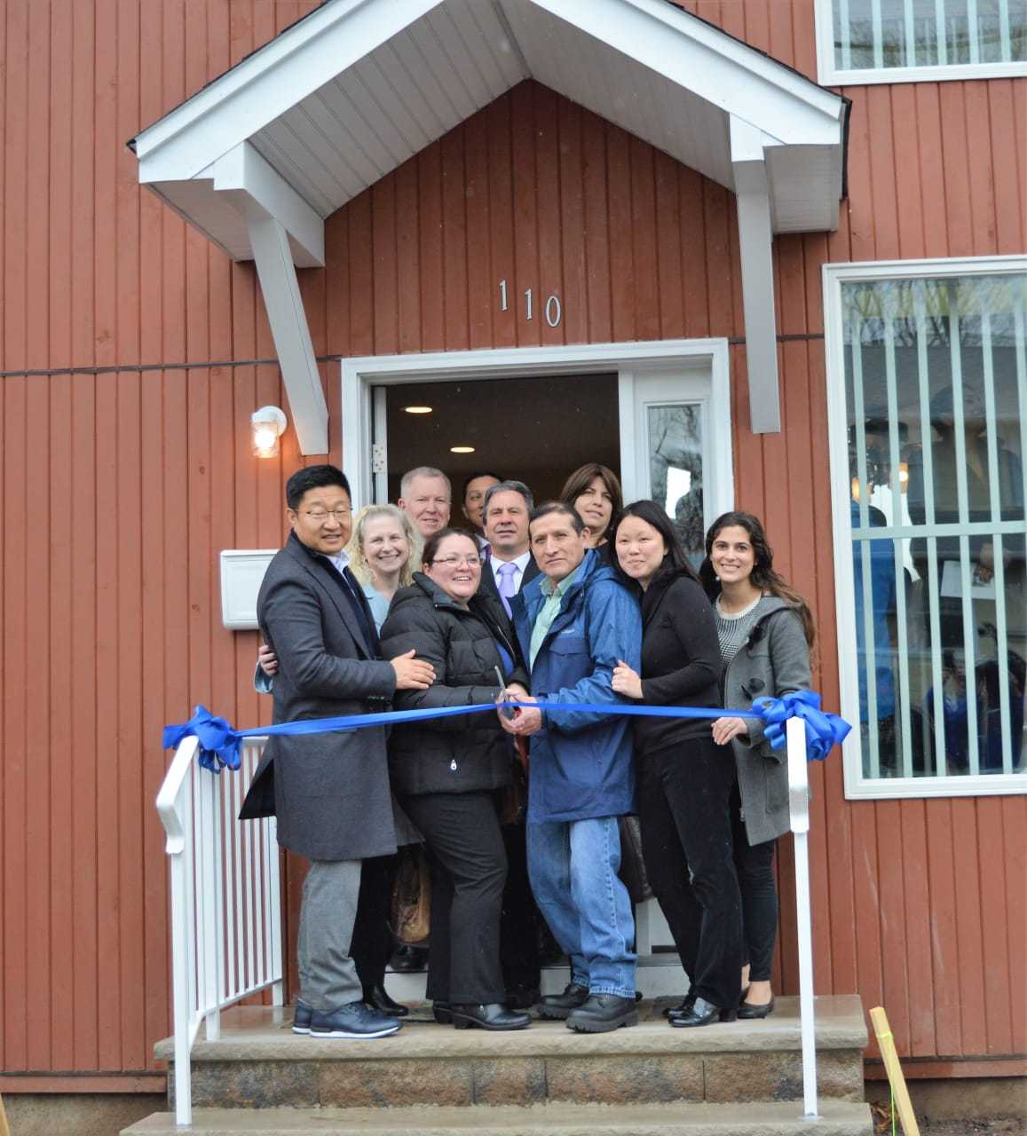 Cutting the ribbon on the 1,900-square-foot home on Bergen Avenue.