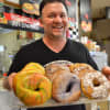 Marc Windler of Bakin' Bagels with a tray of fresh-baked bagels.