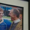 A photo of Pardy with his son sits prominently on his office wall.