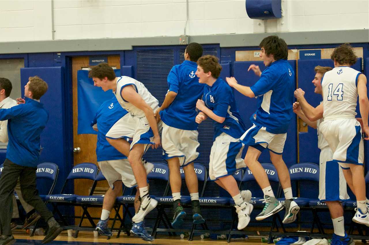 The Hen Hud bench celebrates as the team ties the game at 27-27 seconds before halftime - after trailing 19-3.