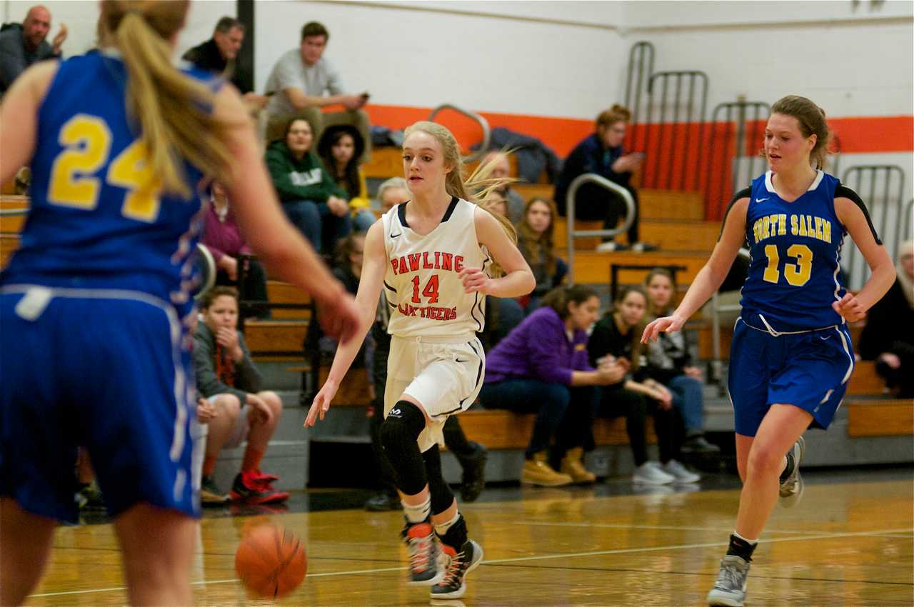Pawling's Mackenzie Meissner (14) brings up ball, as North Salem's Katie McCormack (13) follows.