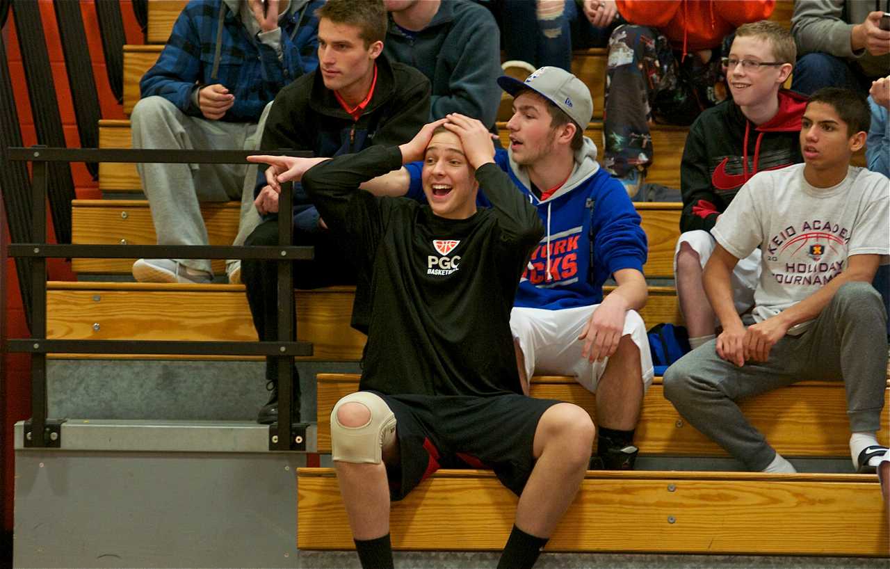 A fan reacts to something he sees on the court.