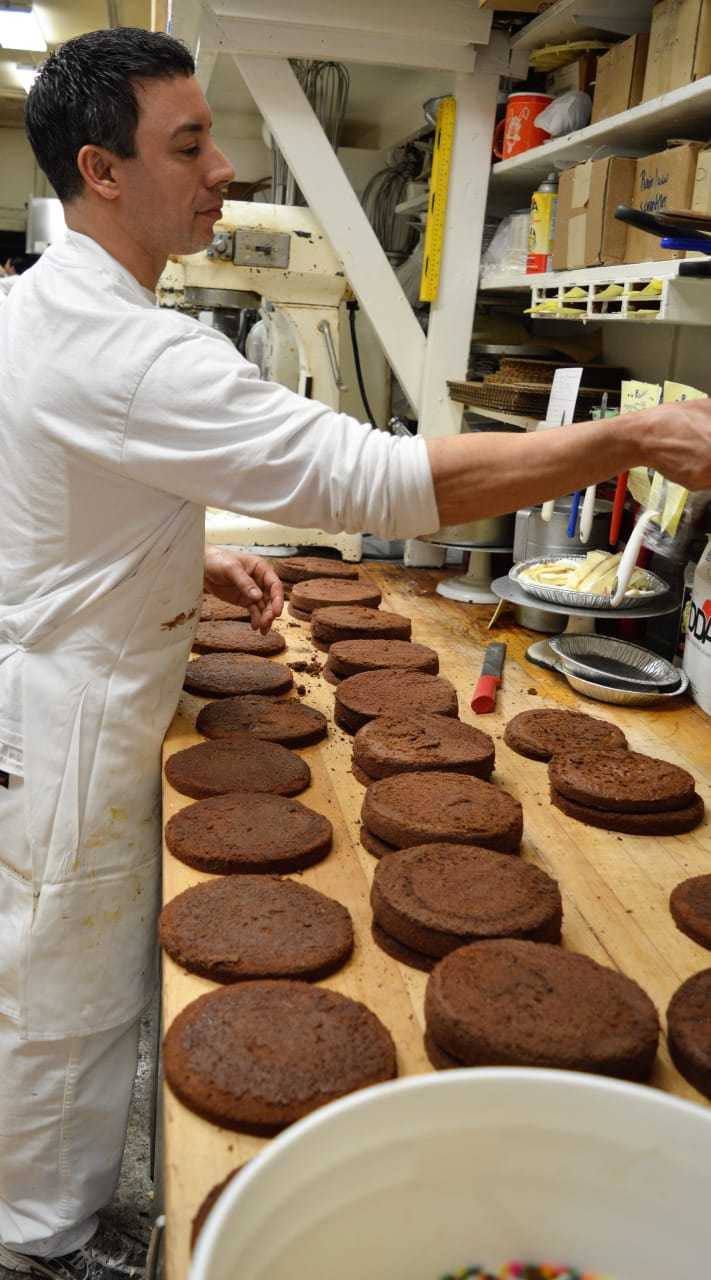 Pastry Chef Scott Casey of New Milford, a U.S. Army veteran who graduated from The Culinary Institute of America, works on Chocolate Oreo Cakes at Reinhold's Quality Bakery.