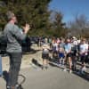 A race official gives last-minute instructions before the 5K.