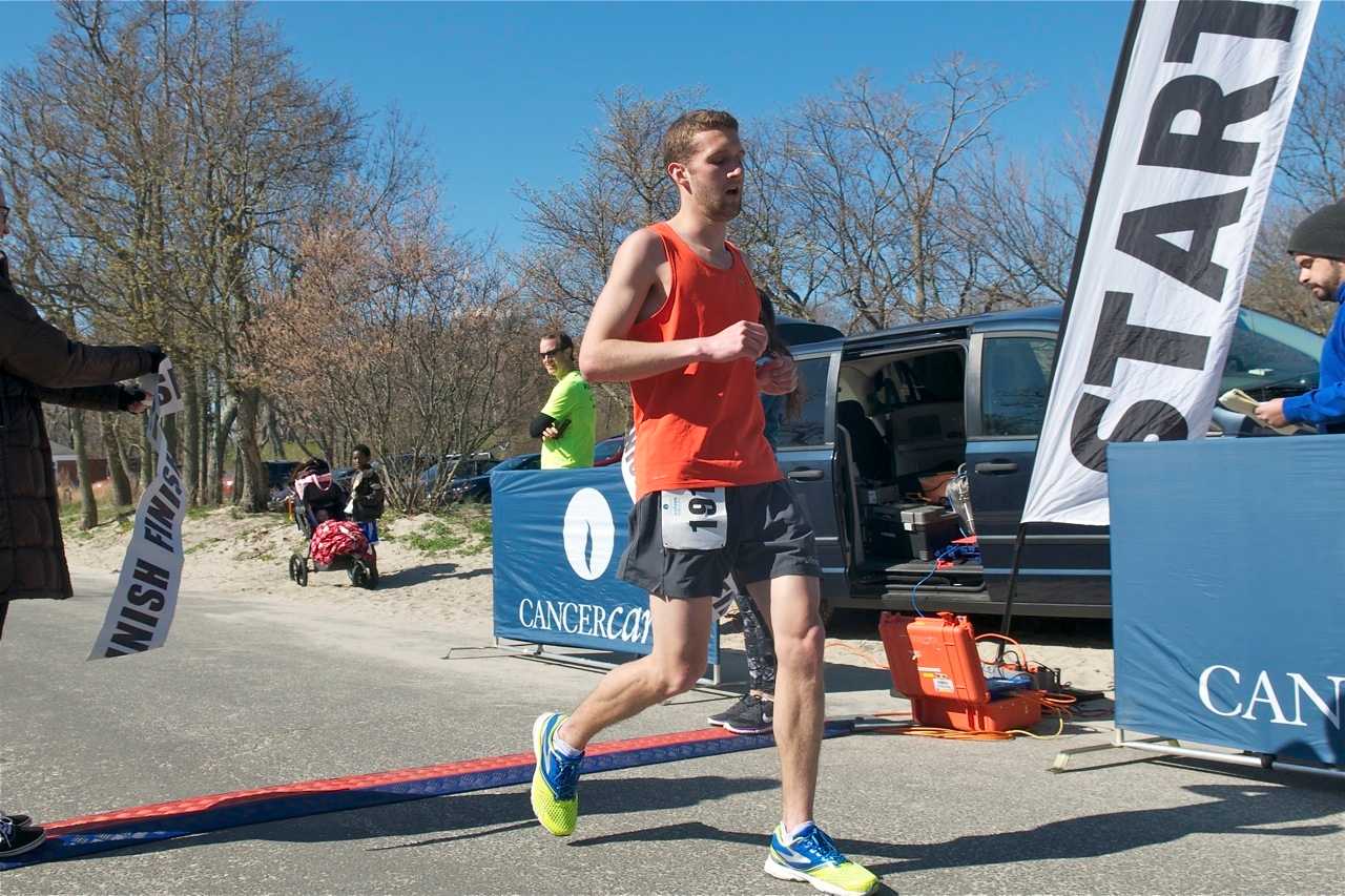 Ian Stowe of New Rochelle crosses the finish line first at 17:40.