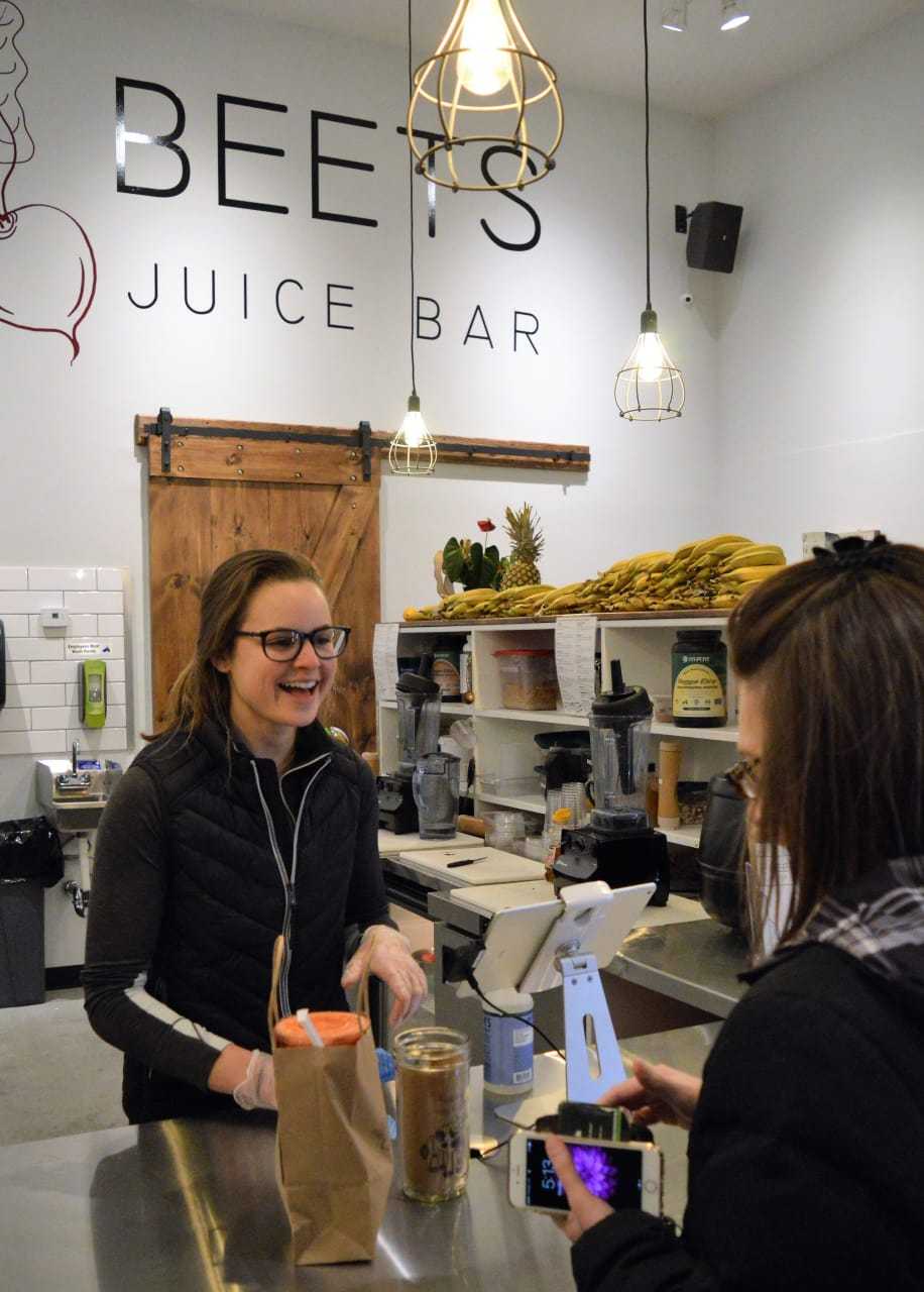 Jessica Piatt helping a customer at the new Beets Juice Bar in Park Ridge.
