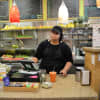 <p>Jocelyn working the counter at Super Juice Nation in Ridgewood.</p>