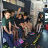 Kids from the Side by Side School get a tour of an ambulance as part of EMS Services Week.
