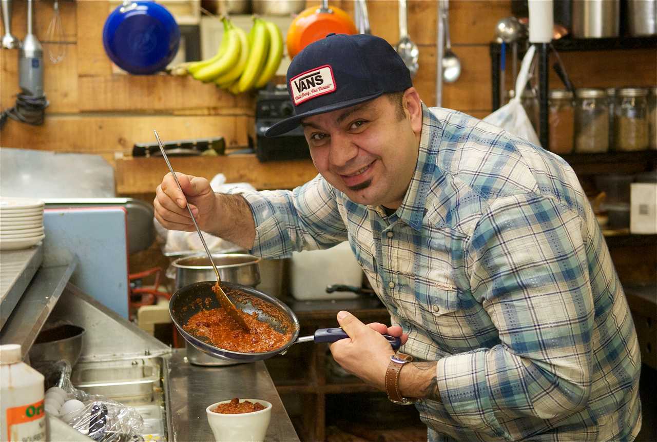 A chef prepares a hearty soup at Beacon Bread.