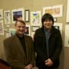 Samuel Kim (right) of Stamford High, with her teacher Paul Cusano, next to Kim's artwork (at right).