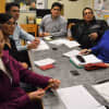 Around the table at an English as a Second Language class are, from the left, Agnes Chung, Frieda Alvarenga, Aitzaz Ashraf, Rafael Padron, Vicente Acosta and backup tutor Mary Cadillac of Palisades Park.