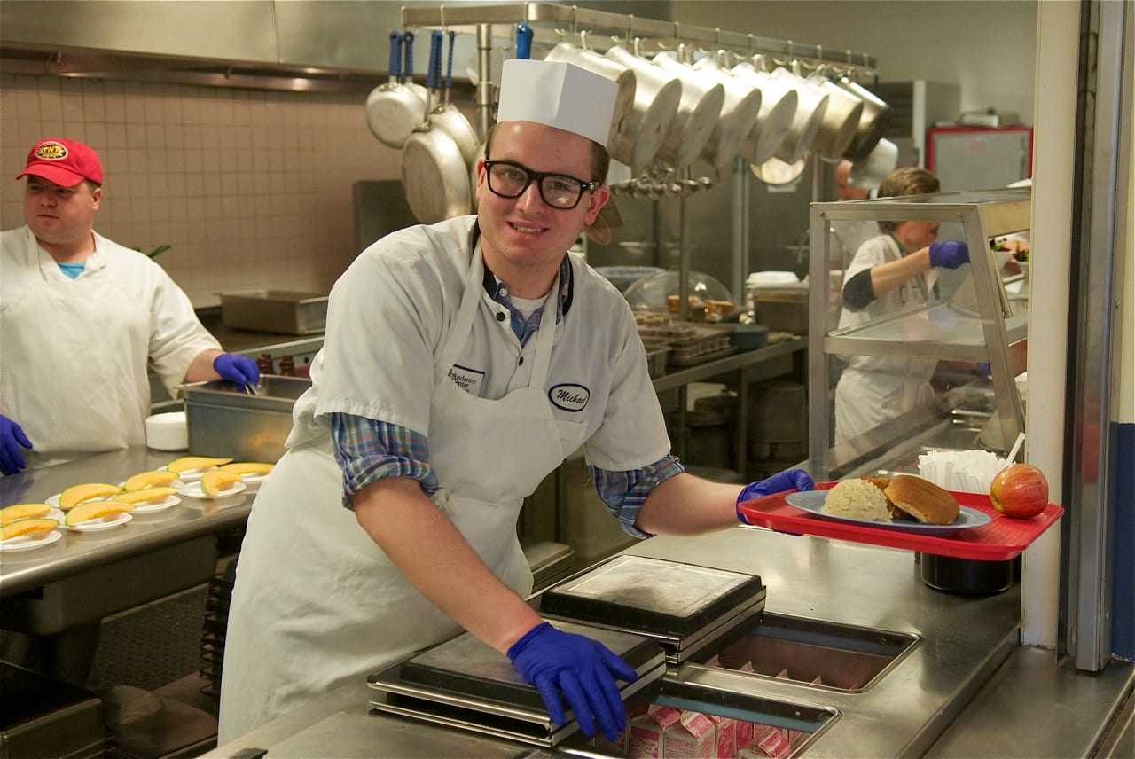Michael at his job in the kitchen at Anderson Center for Autism.