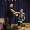 <p>Fourth grader Michael Amato is amazed by Danny Magic&#x27;s animal cracker trick.</p>