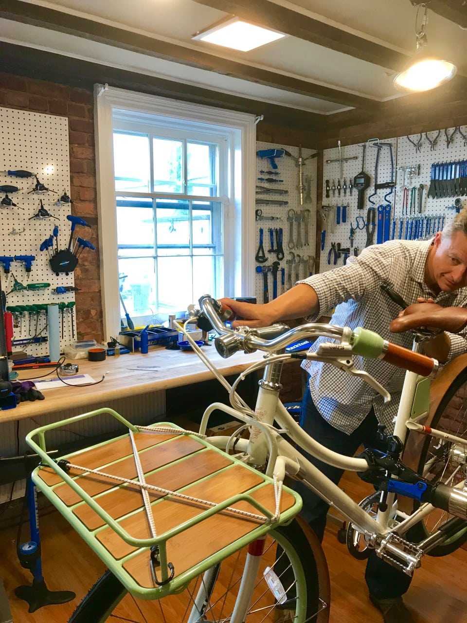 Examining a bike at Sleek eBikes in Tarrytown.