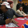 Dwight "Doc" Gooden and Noah Syndergaard signing autographs in the LaPenta Student Union at Iona College.