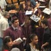Bethel High School graduates show off their college plans on their mortarboards.