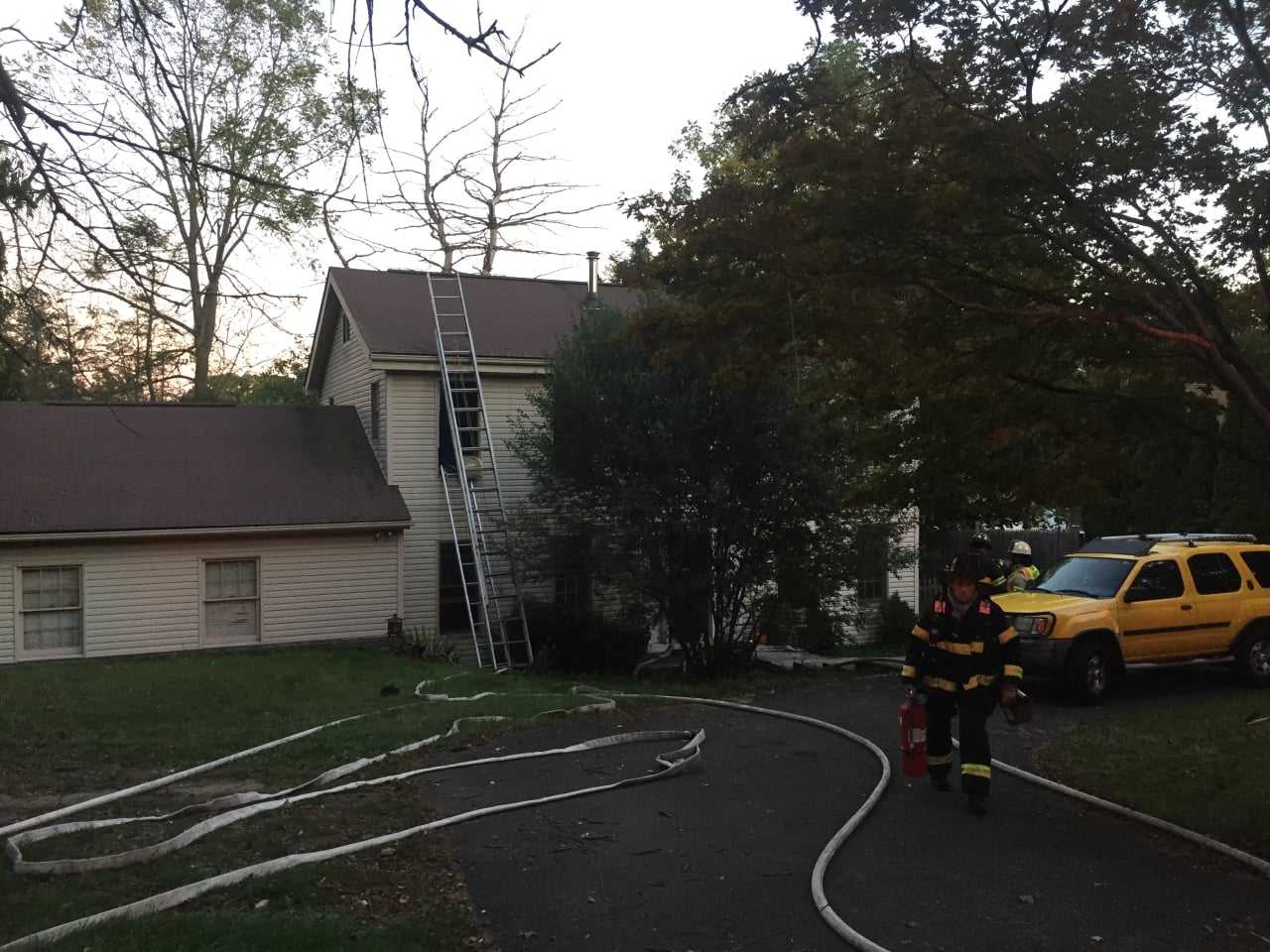 Danbury firefighters at the scene of a two-alarm blaze at 43 Stadley Rough Road on Tuesday evening.