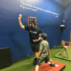 Stanley works with an athlete at Complete Game in Allendale.
