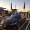 <p>A Tesla recharges at the Darien I-95 South rest area Monday afternoon. The state&#x27;s recently rebuilt service plazas offer charging stations for electric vehicles. </p>