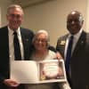 Phil Oldham of Larchmont, left, received the Lions Club President's Certificate of Appreciation from District Governor Norma Mendez Cruz and Past International Director Douglas Alexander.