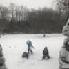 Dane, Eleanor and Conor Raveis play in the snow in Fairfield.