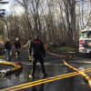 Firefighters tackle a blaze at a property at 610 Cheese Spring Road in New Canaan on Friday. One crew from Pound Ridge, N.Y., responded.