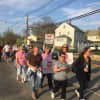 Dumont residents march in protest of the proposed redevelopment of the former D'Angelo Farms site.