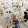 Kids painting mural at Greenacres Elementary School