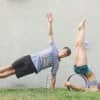 Michael Taylor and Jessica Morfa using yoga wheels.