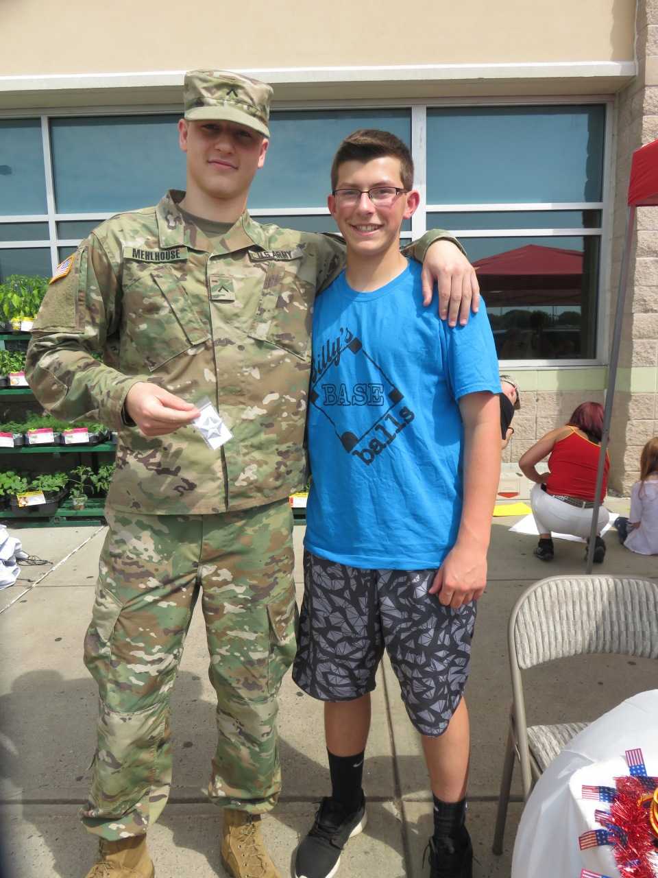Billy Cook meets a soldier at a signing event in Connecticut on Saturday.