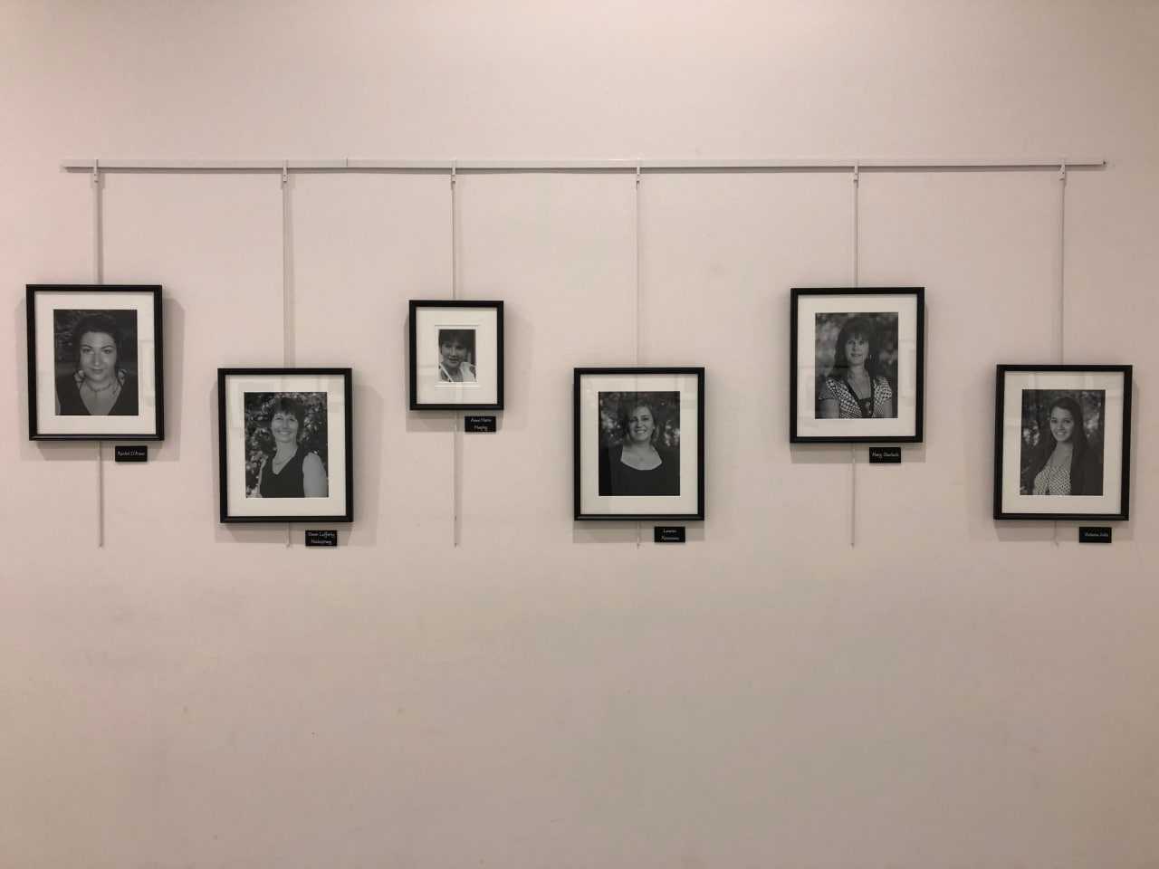 The Wall Of Remembrance includes black-and-white photos of the 26 victims of the Sandy Hook School shooting.