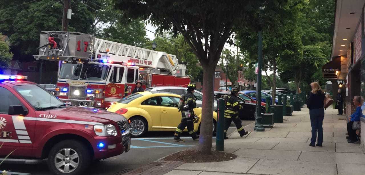 Maywood firefighters clear the Oak Ale House Monday evening.