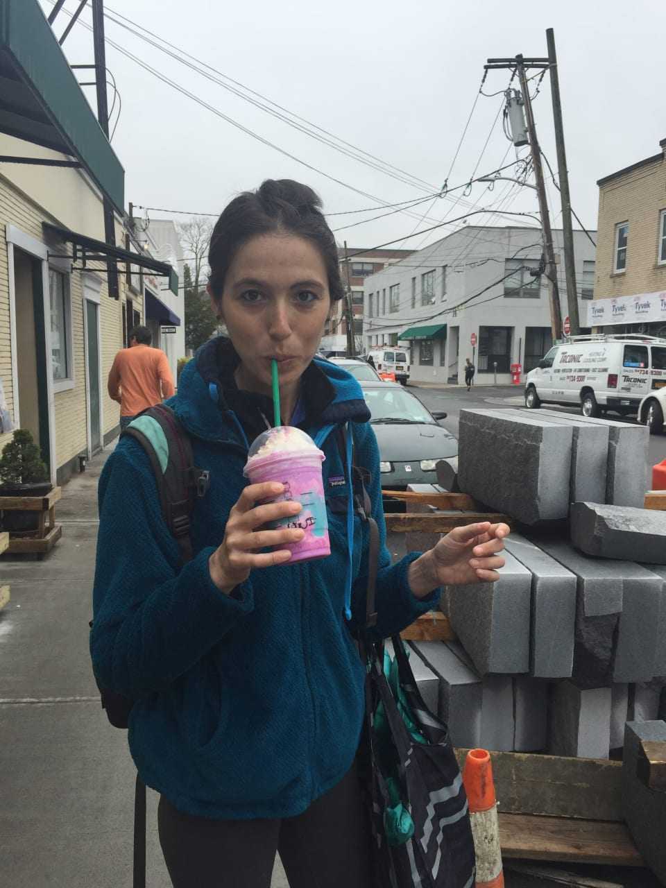 Rye resident Emily Raho tries Starbucks new unicorn frappuccino.