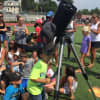 Looking through the telescope at New Rochelle High School for the solar eclipse.
