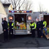 Members of the Norwood EMS piled the items locals donated into an ambulance and a trailer.