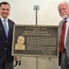Dutchess County Executive Marcus J. Molinaro, left, and Dr. Kenneth M. Glatt, former county commissioner of mental hygiene, unveil a plaque honoring Glatt at the county's new stabilization center.