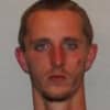 Justin Parker was charged with shoplifting and providing state police with a fake name after he was accused of stealing items from a grocery store.