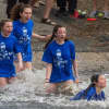 Participants in a past YAASA polar bear plunge test the chilly Cupsaw Lake water in Ringwood.